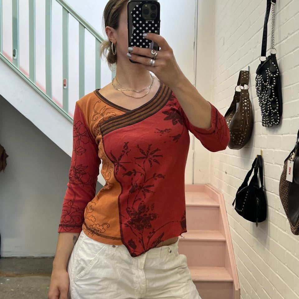 Orange and red graphic print top