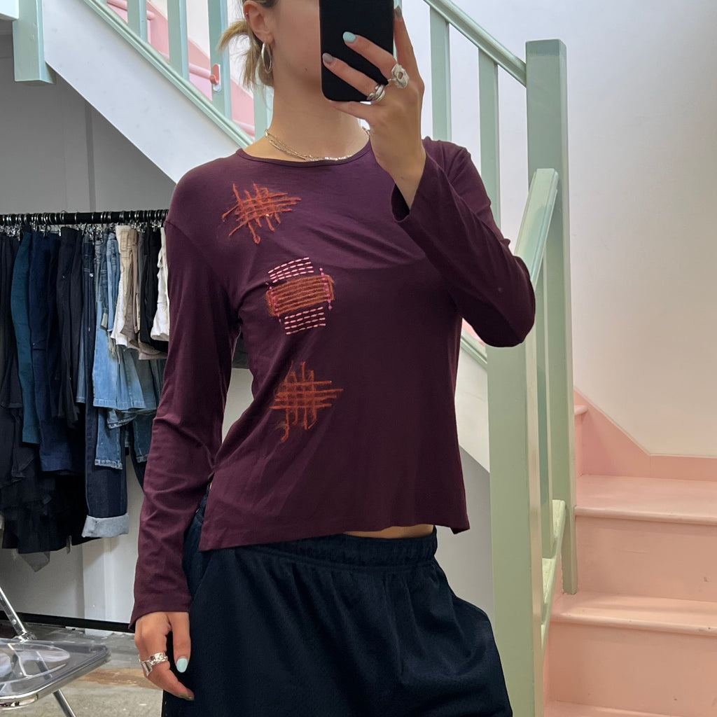 Propel mad orange contrast stitch top,