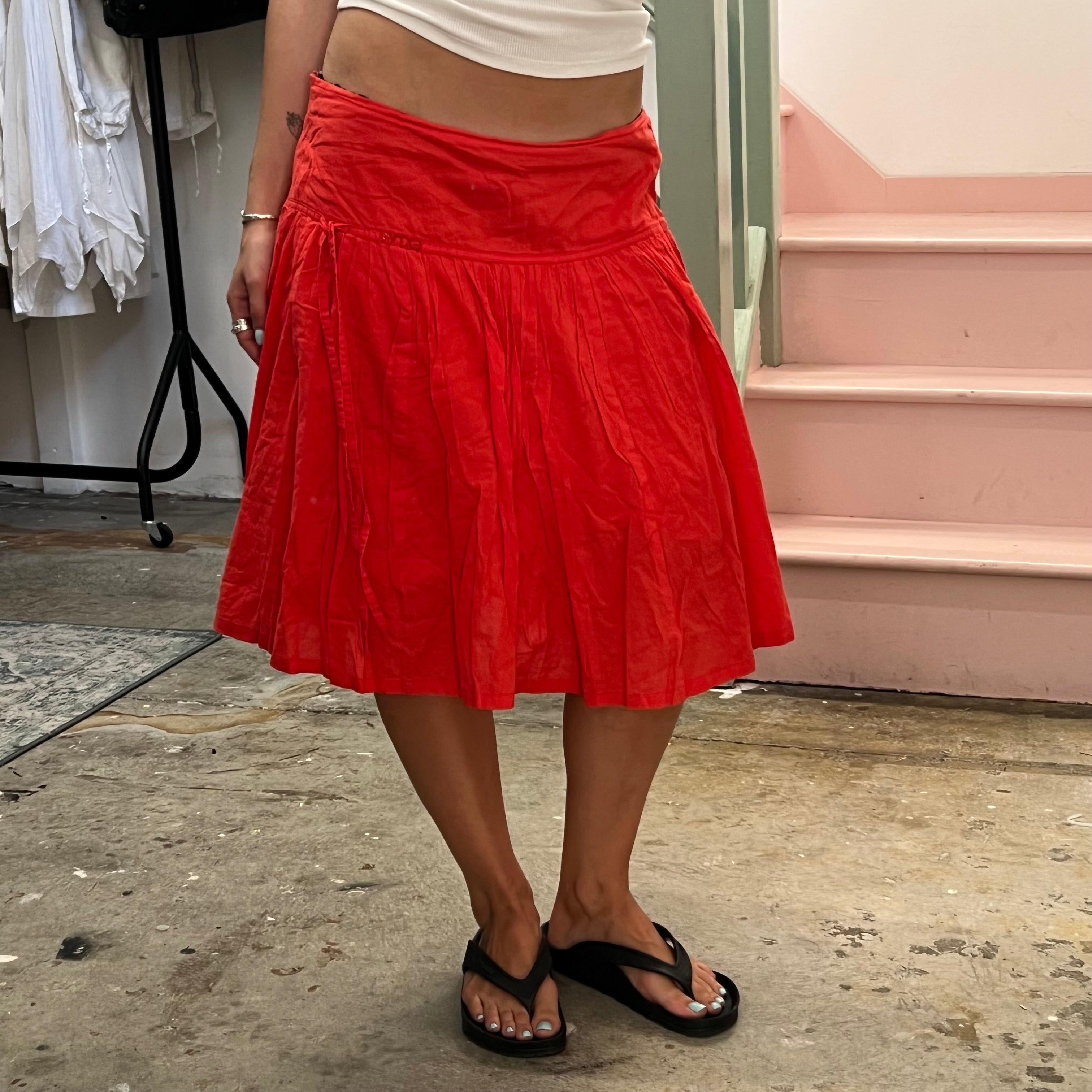 Red low rise pleated floaty midi skirt