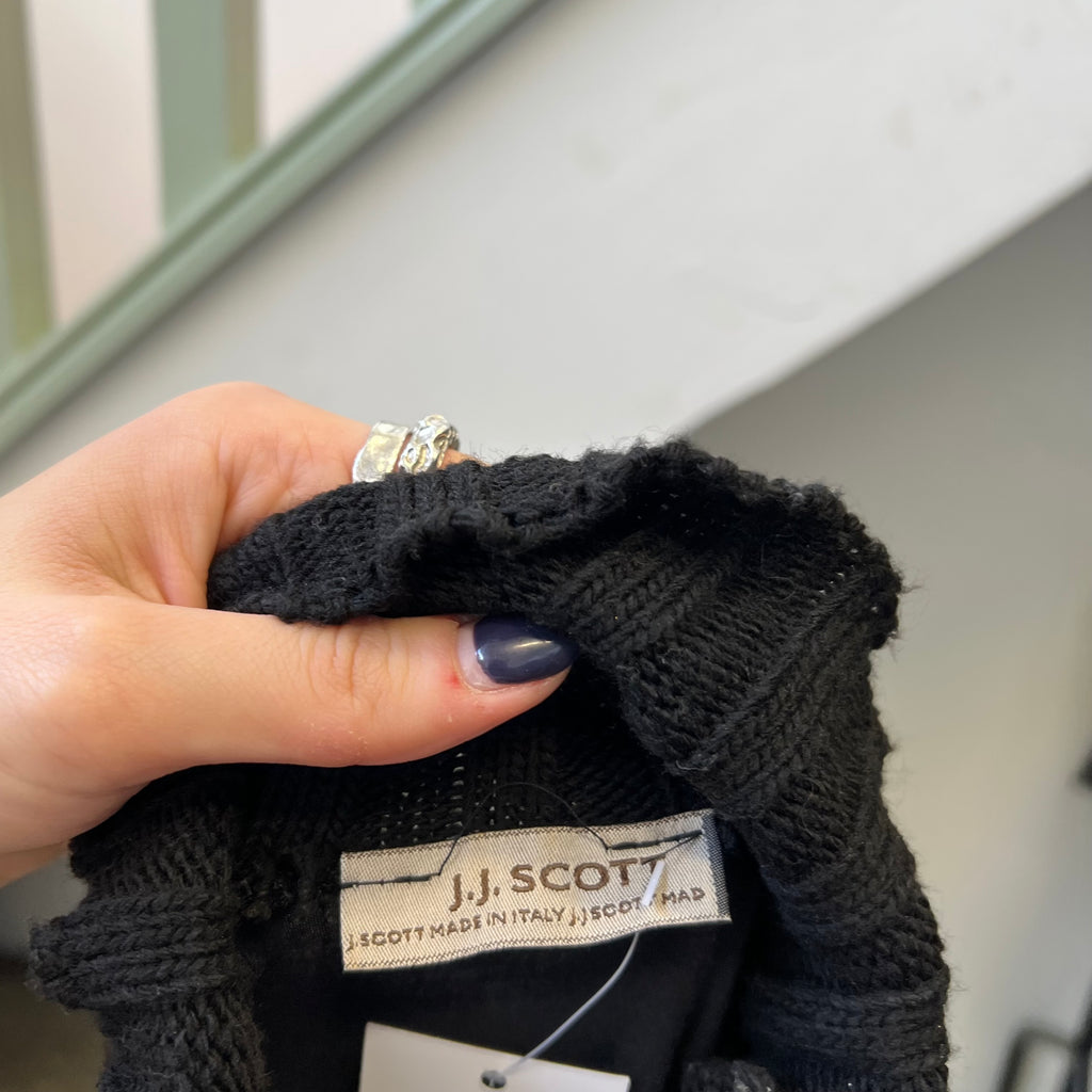 Black roll neck top with zips and buckles