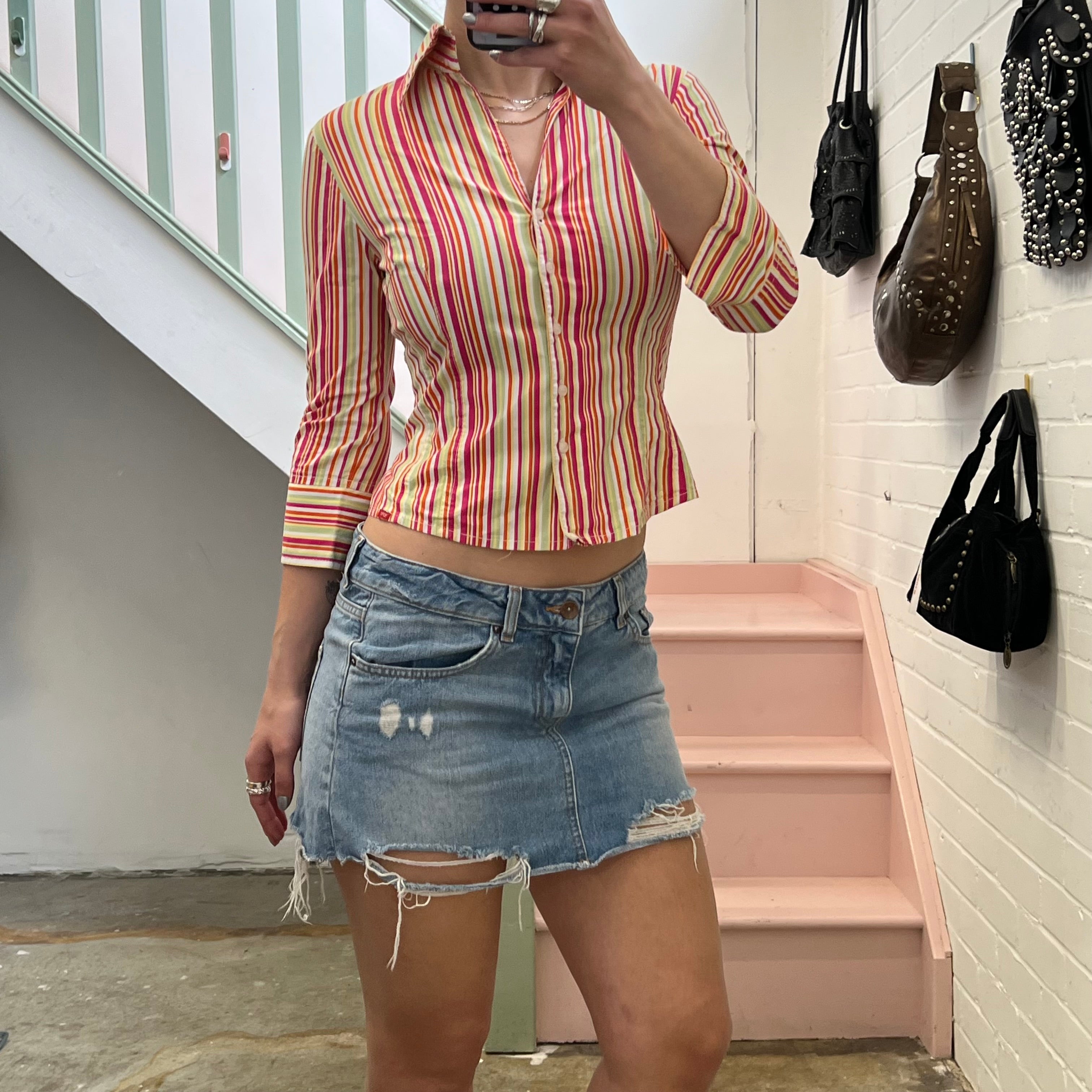 Distressed light wash denim mini skirt