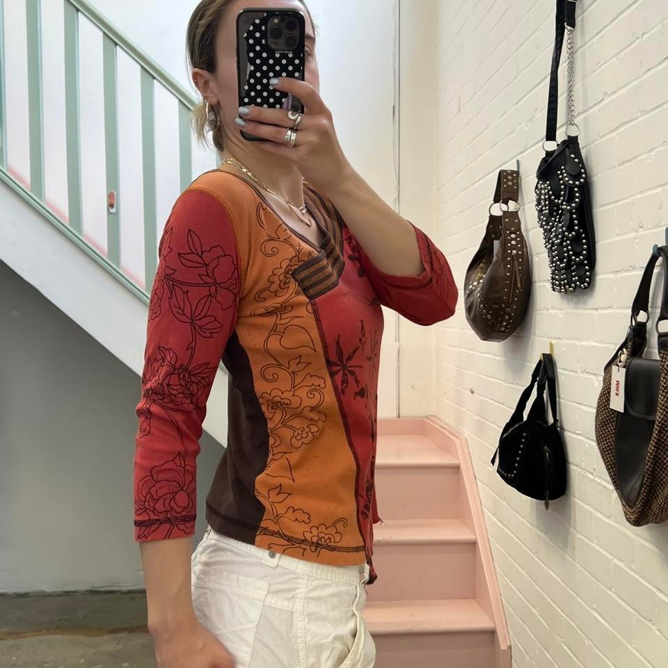 Orange and red graphic print top