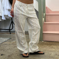 White and multi colour stripe trousers