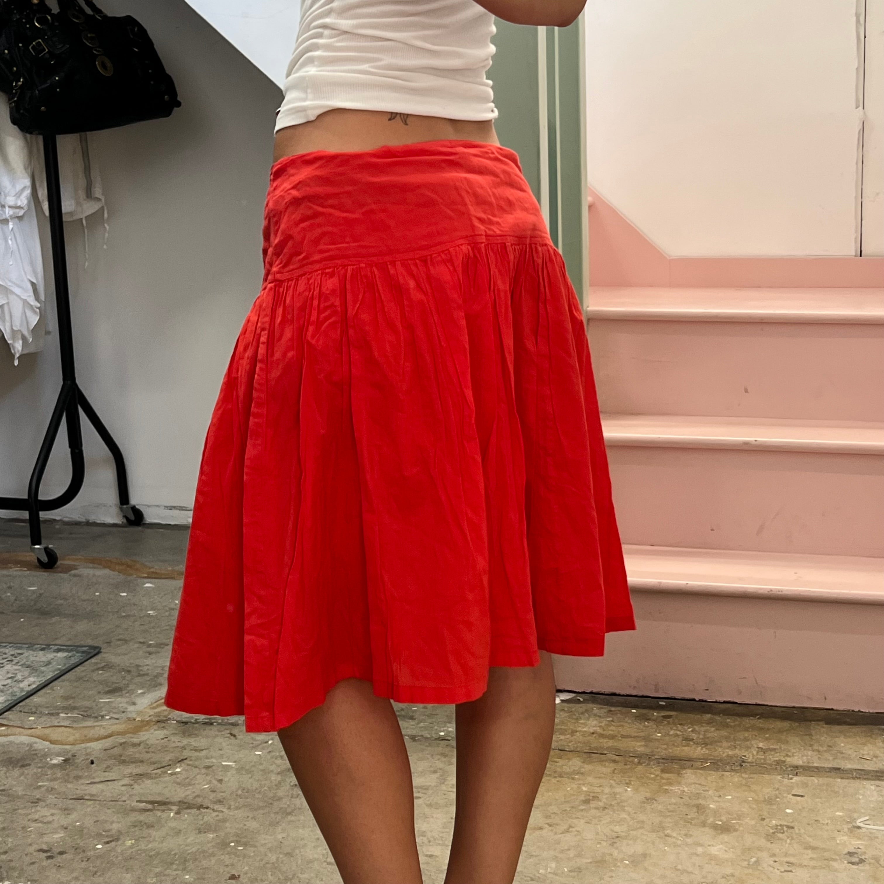 Red low rise pleated floaty midi skirt