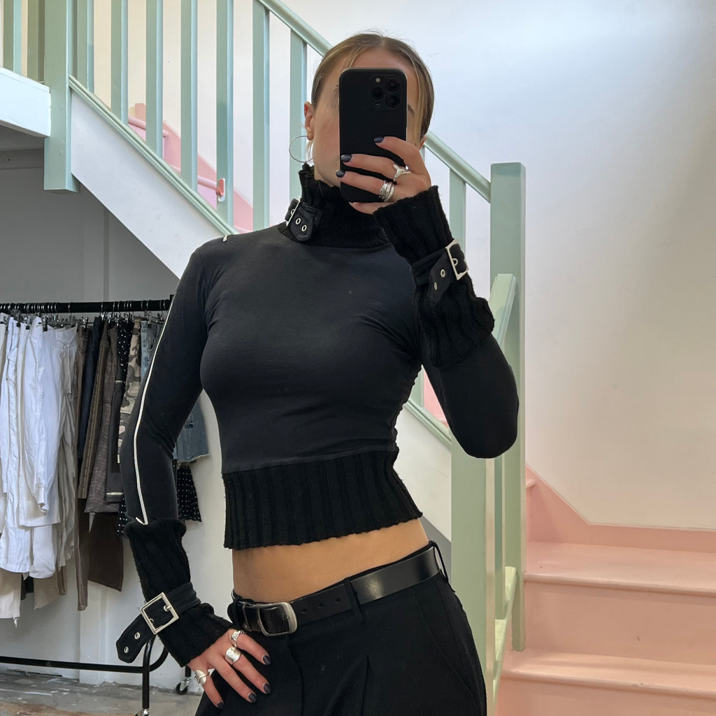 Black roll neck top with zips and buckles