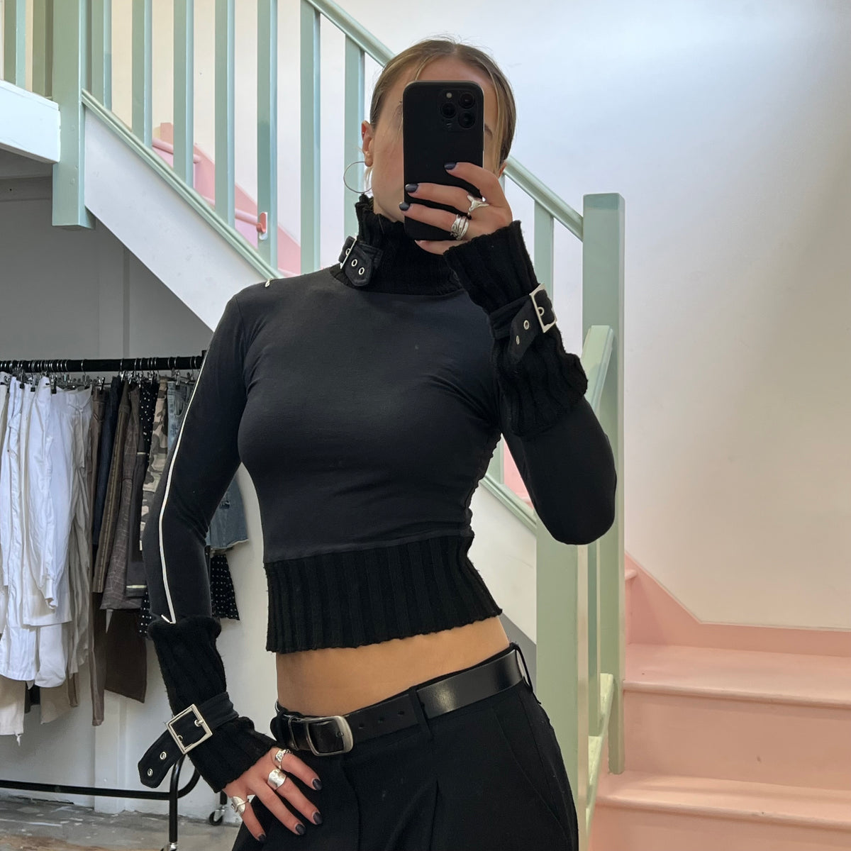 Black roll neck top with zips and buckles