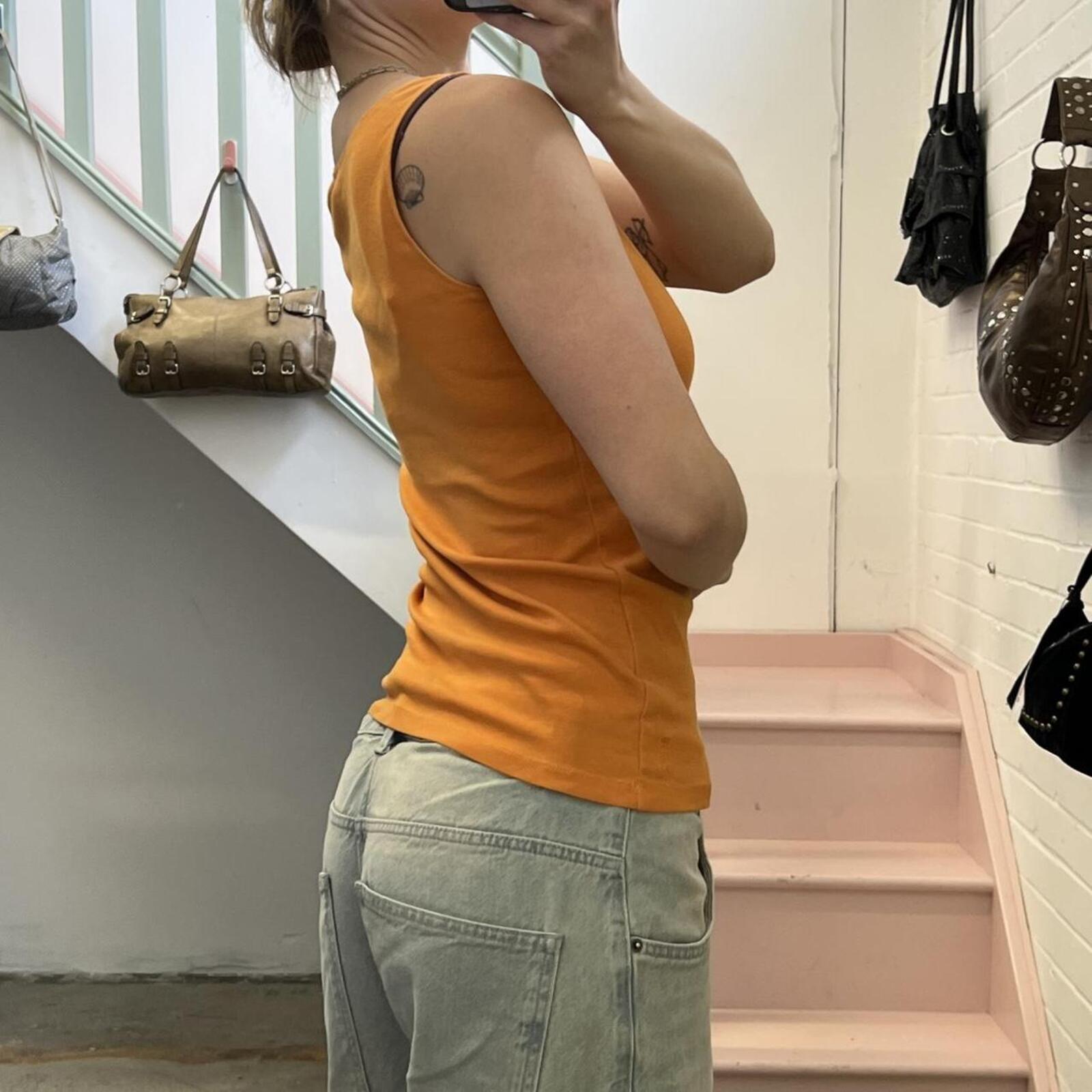 Orange fitted vintage vest with ring detail