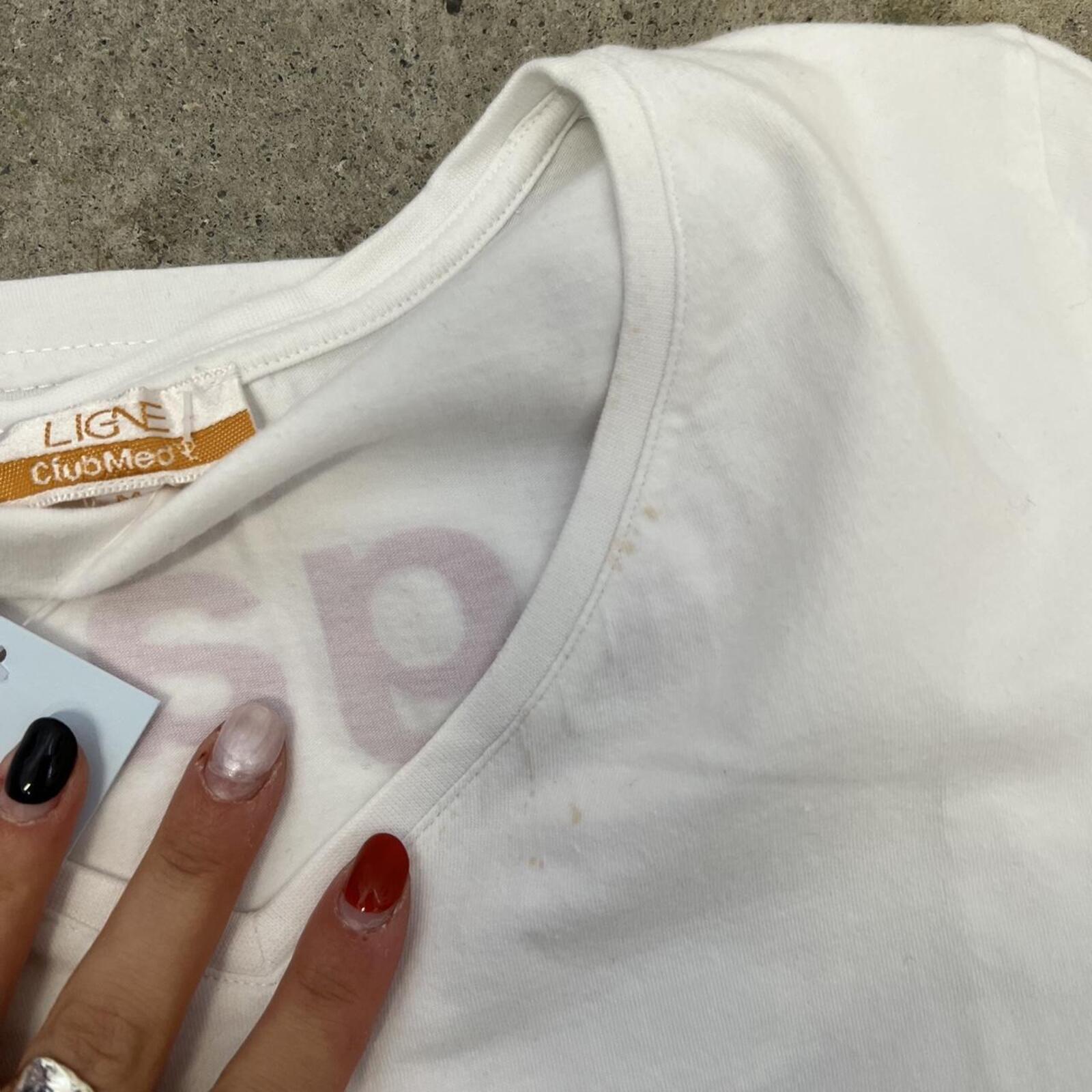 White fitted v neck baby tee with pink number print