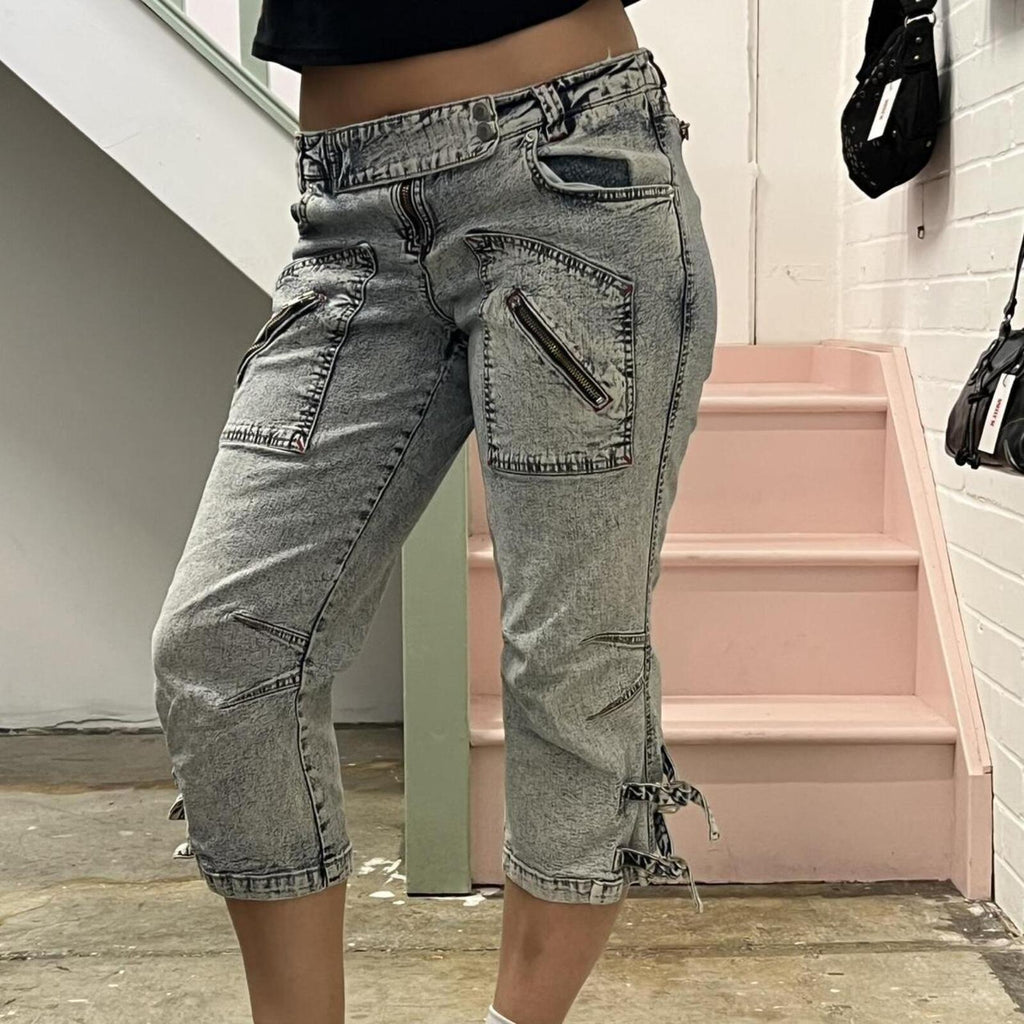 acid wash low rise denim capris with zips and buckles