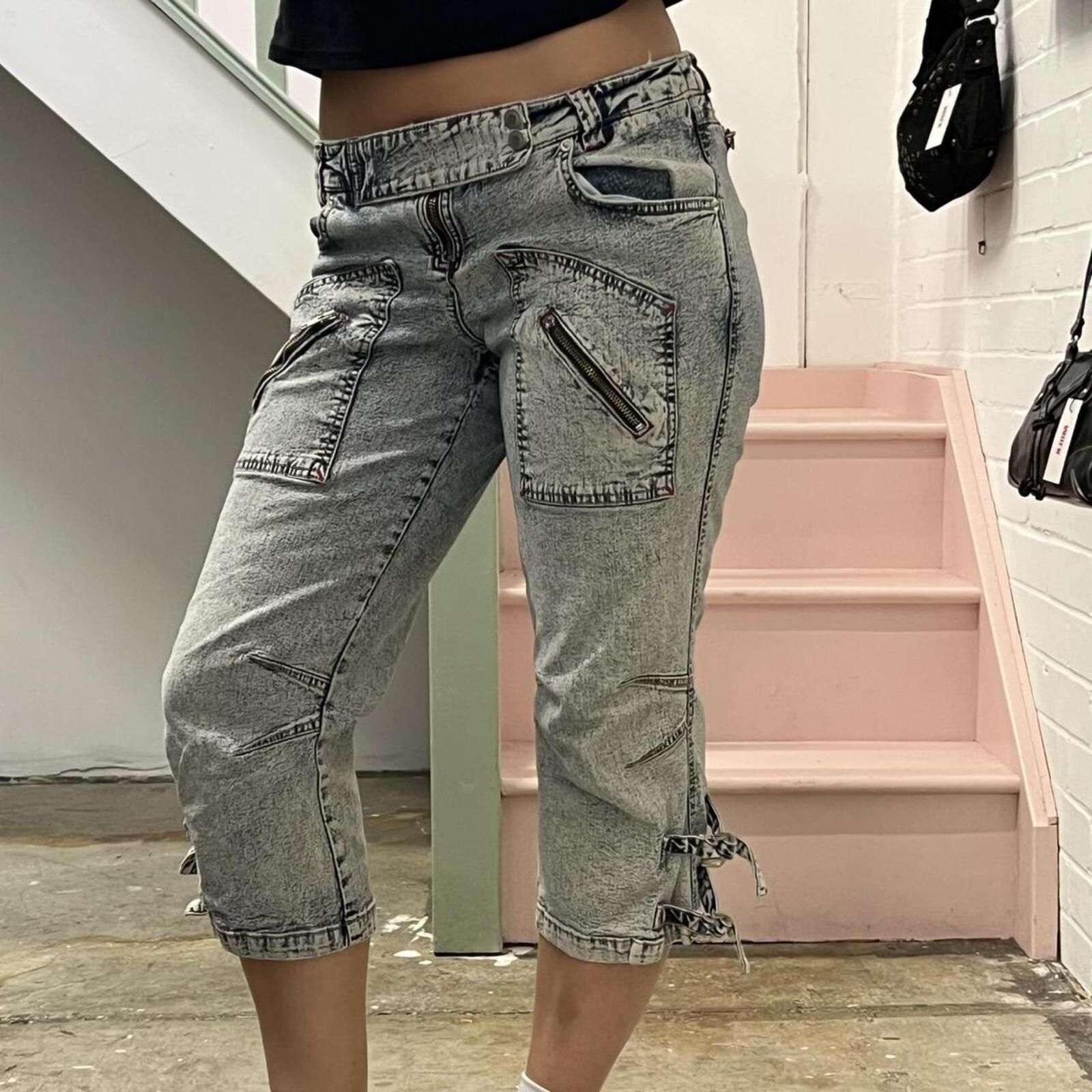 acid wash low rise denim capris with zips and buckles