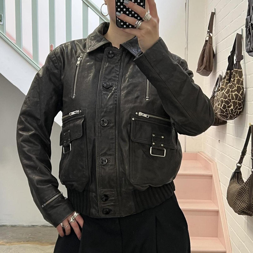 dark brown black vintage leather bomber jacket with silver buckles, oversized button and detachable fur trim hood