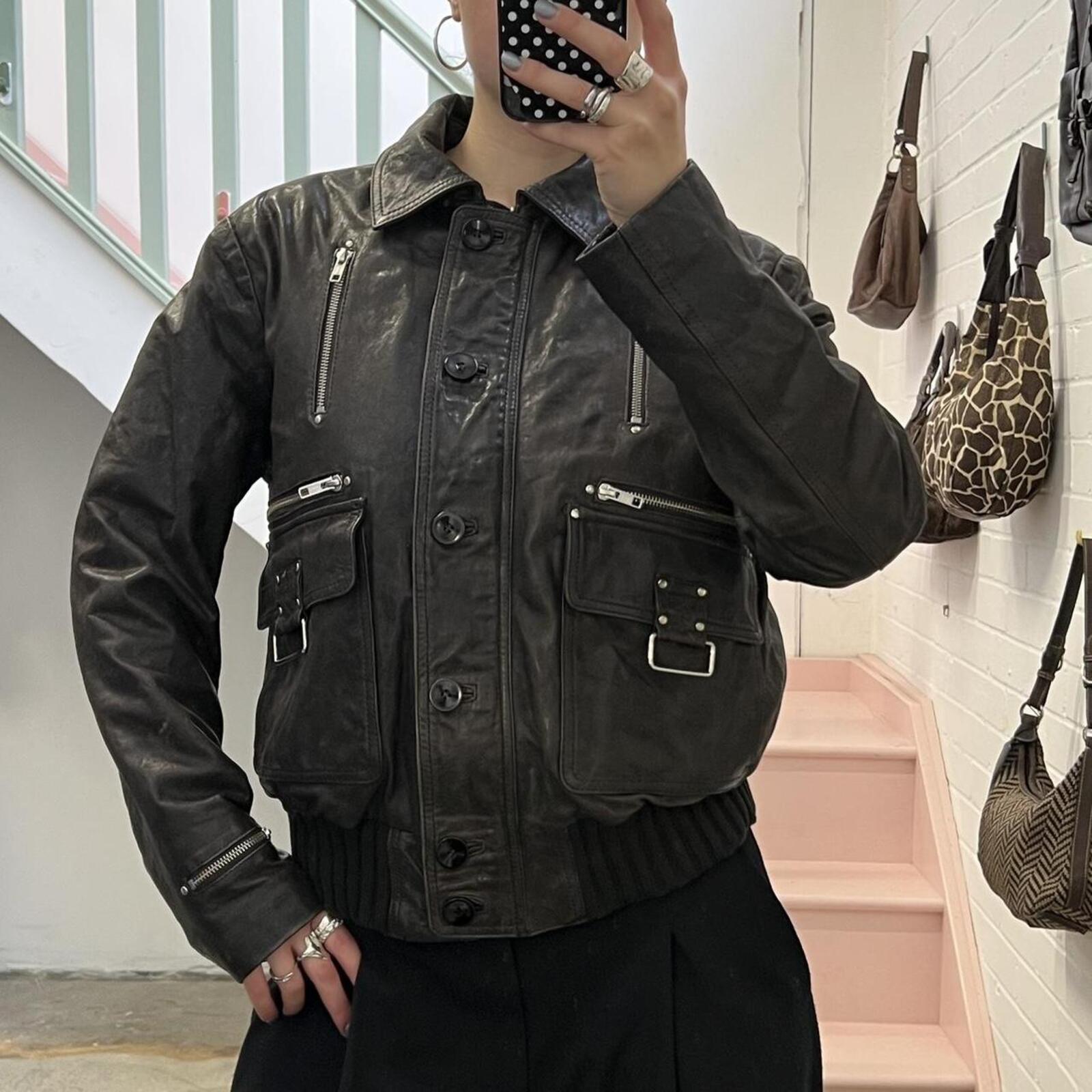 dark brown black vintage leather bomber jacket with silver buckles, oversized button and detachable fur trim hood