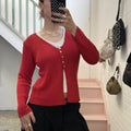 red knitted vintage cardigan with pearl buttons