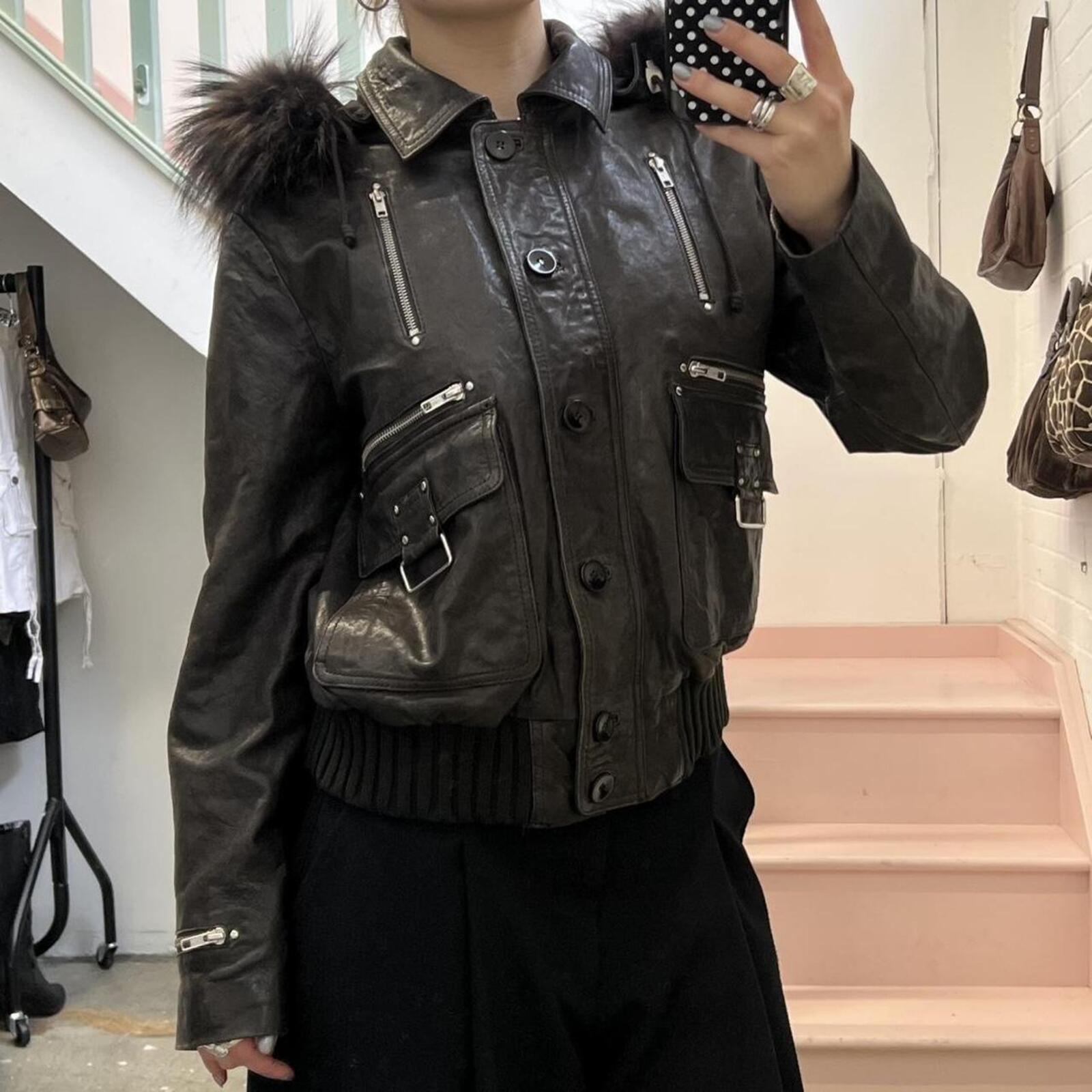 dark brown black vintage leather bomber jacket with silver buckles, oversized button and detachable fur trim hood