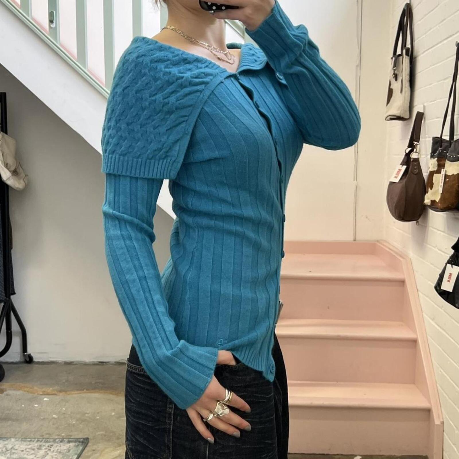 blue knitted off shoulder button up cashmere blend sweater