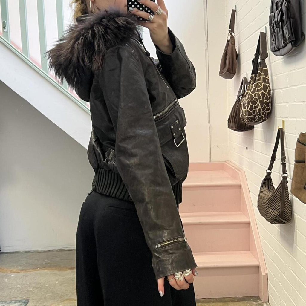 dark brown black vintage leather bomber jacket with silver buckles, oversized button and detachable fur trim hood